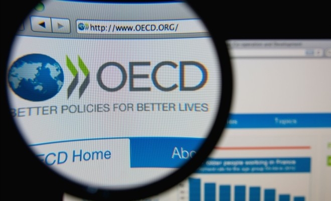 OCDE și-a redus estimările privind creșterea economiei mondiale în acest an din cauza tarifelor